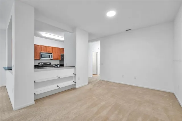 a view of room with flat screen tv