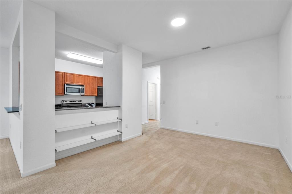 8206 Bally Money Road Tampa, FL 33610 - Photo 9 of 43 a view of room with flat screen tv