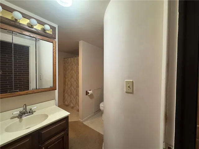 a view of staircase with rug