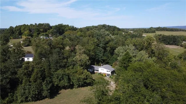 an aerial view of residential house with outdoor space