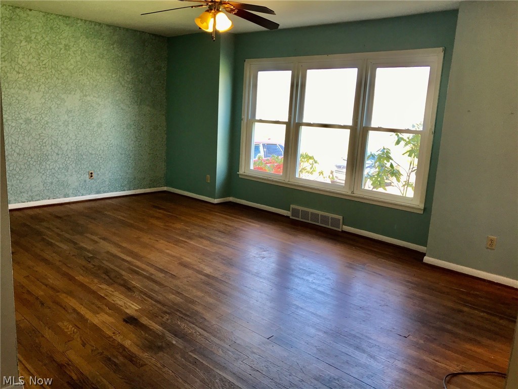 1884 Meadows Road Madison, OH 44057 - Photo 10 of 27 Spacious 13 x 19 living room. Newer windows and original hard wood floor.