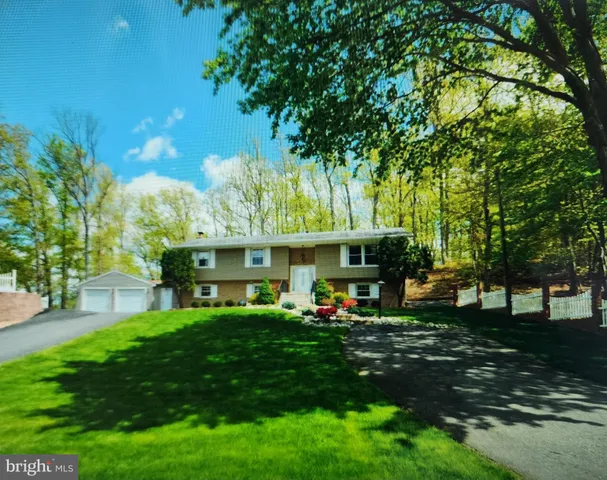 a view of a house with a yard porch and sitting area