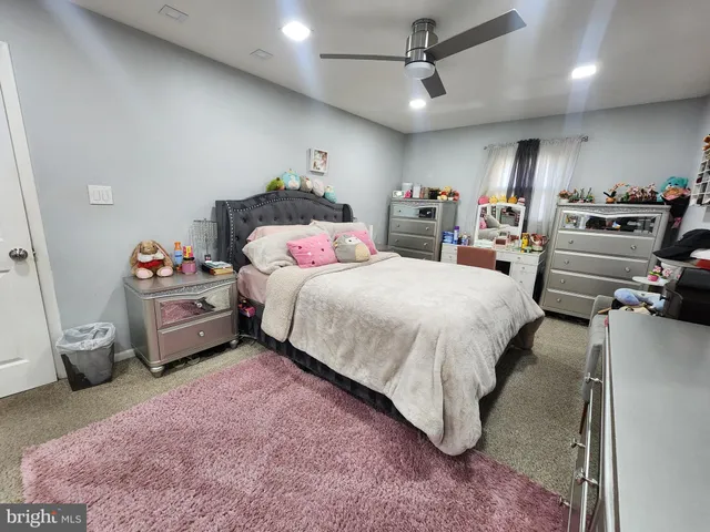 a bedroom with a bed and furniture