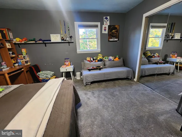 a bed room with a bed and a couch