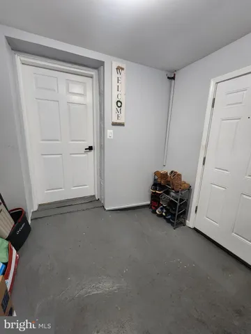 a view of a livingroom with storage and utility room