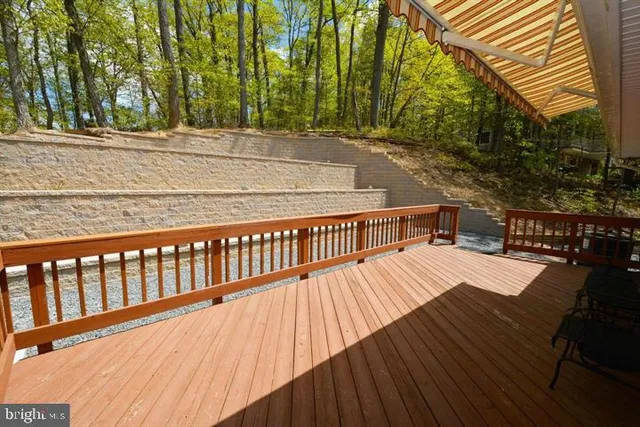a view of balcony with wooden floor and outdoor space
