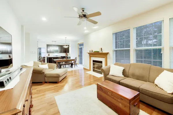 a living room with furniture fireplace and a flat screen tv