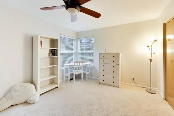 a view of room with cabinet and windows