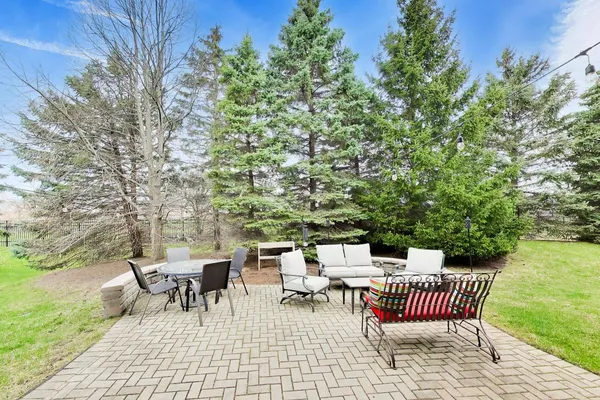a view of a patio with a yard