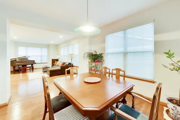a view of a dining room with furniture and wooden floor
