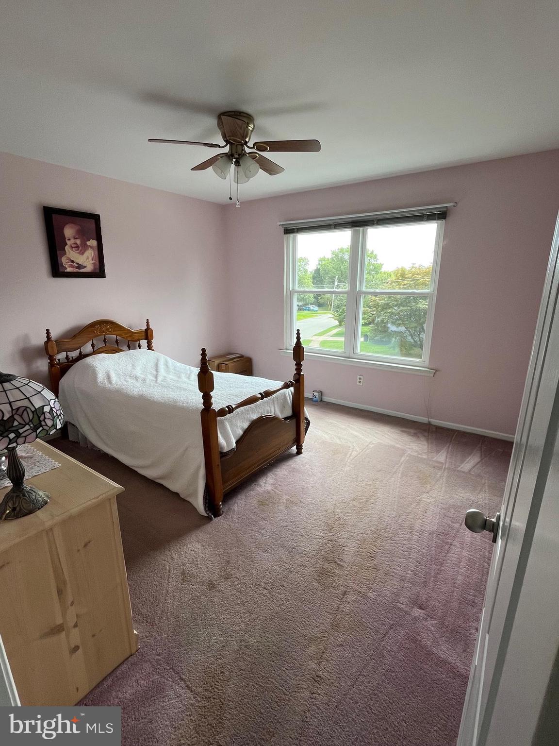 129 Ronald Road Aston, PA 19014 - Photo 41 of 48 a spacious bedroom with two beds and a chandelier