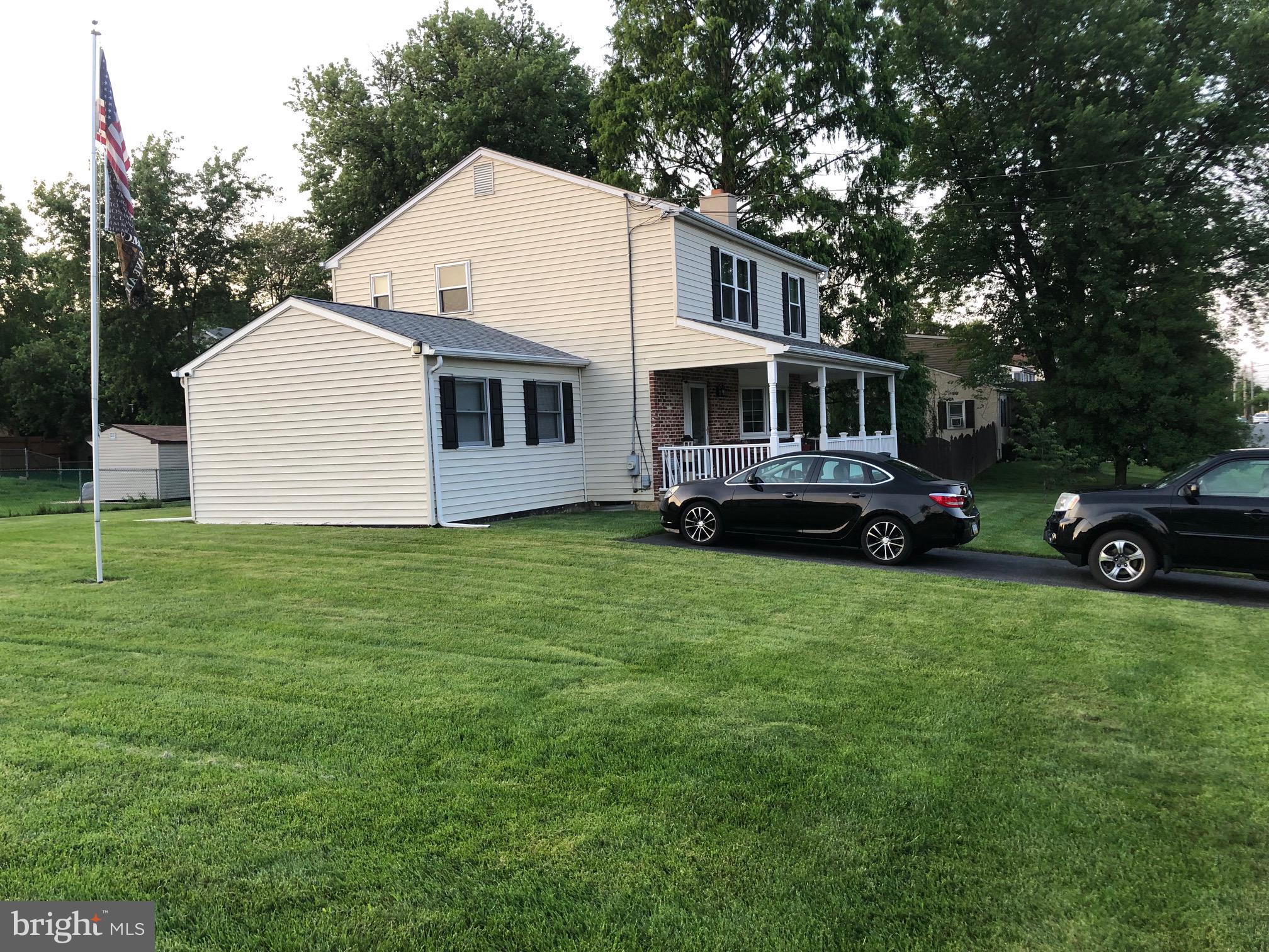 129 Ronald Road Aston, PA 19014 - Photo 8 of 48 a front view of house with yard and car parked