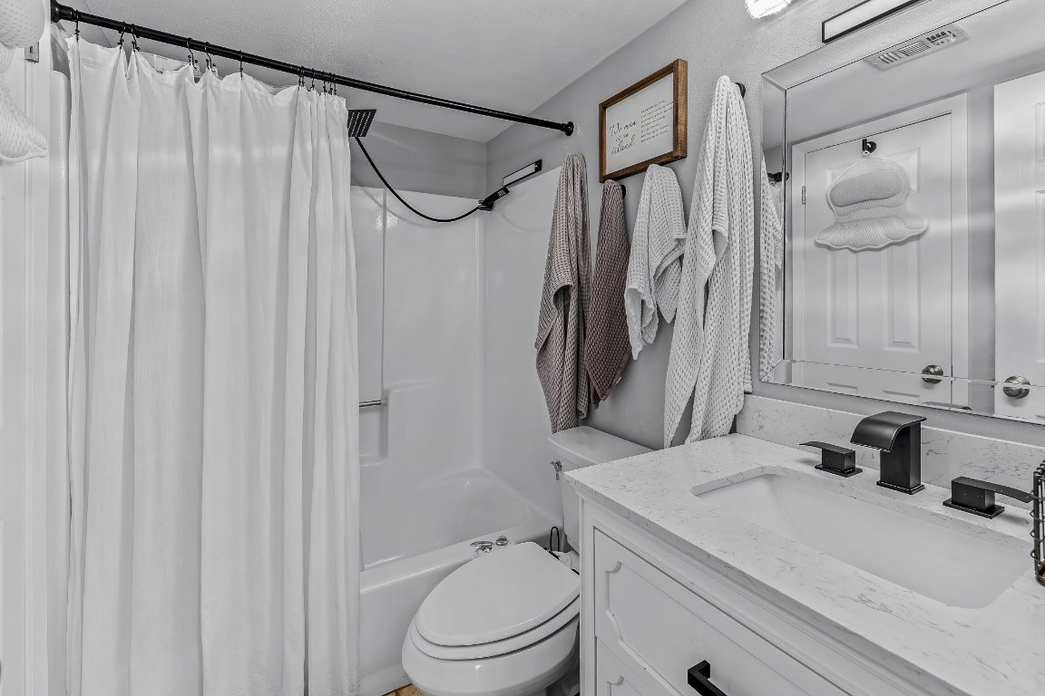 2500 Burleson Road, Unit 621 Austin, TX 78741 - Photo 12 of 26 a bathroom with a granite countertop sink toilet and shower