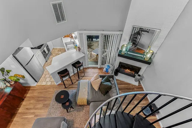 a view of a workspace with wooden floor