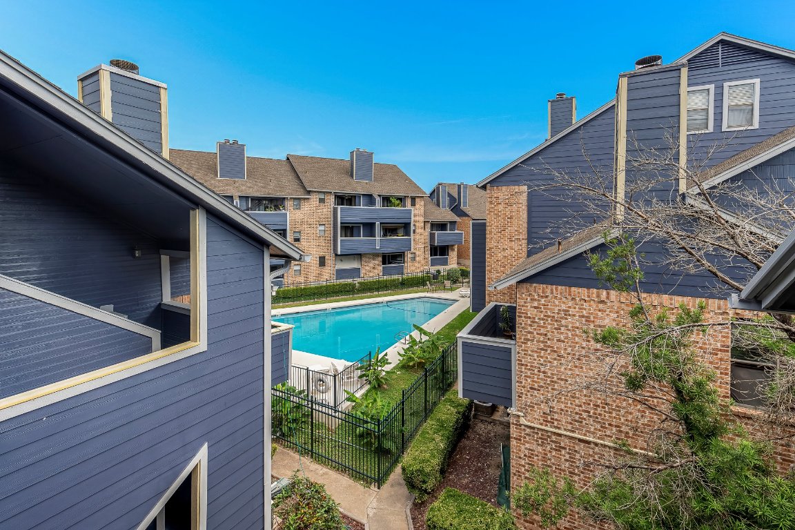 2500 Burleson Road, Unit 621 Austin, TX 78741 - Photo 24 of 26 a aerial view of a house with a yard and balcony