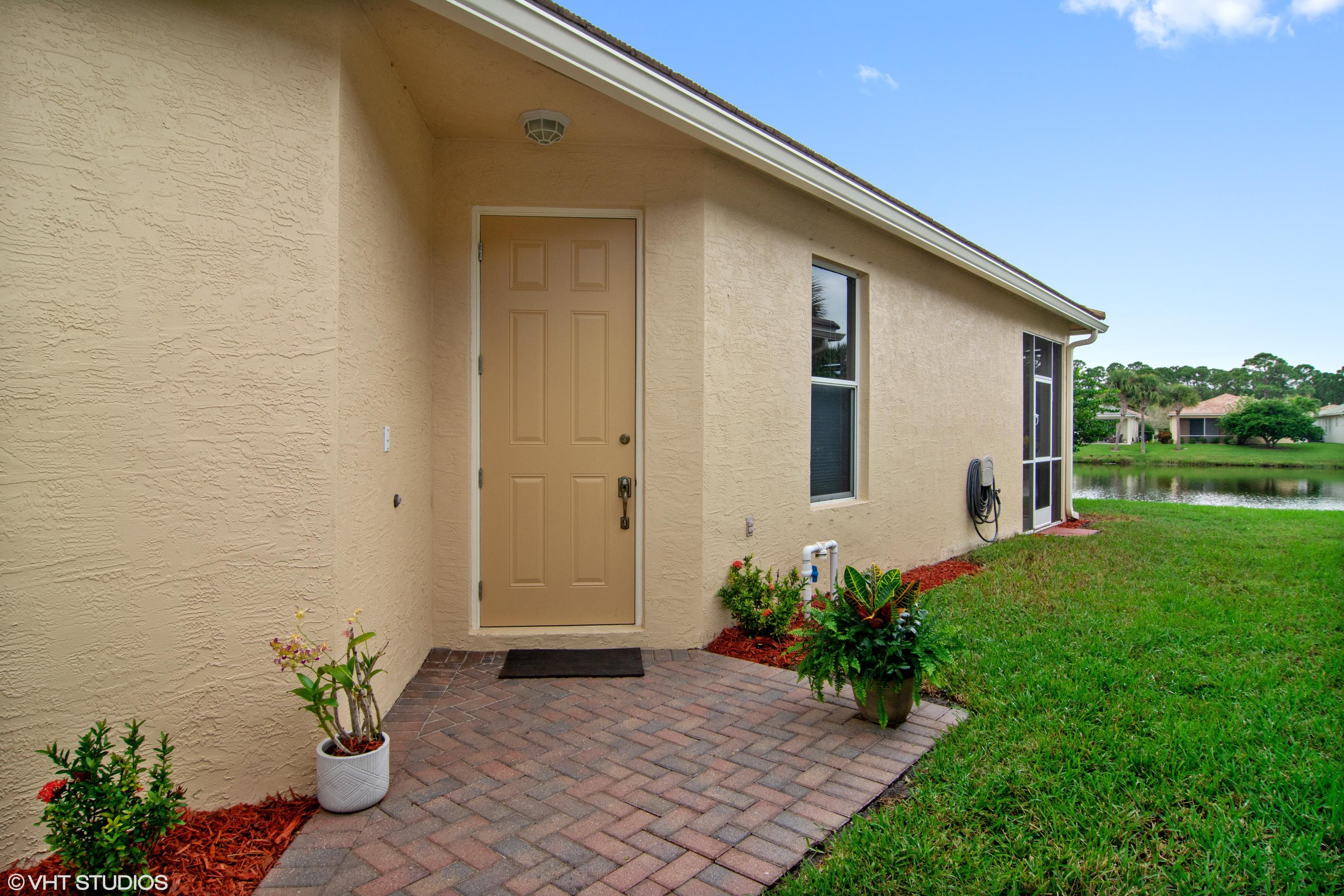 314 Southwest Coconut Key Way Port St. Lucie, FL 34986 - Photo 3 of 28 02_314CoconutKey_301_Entrance_HiRes