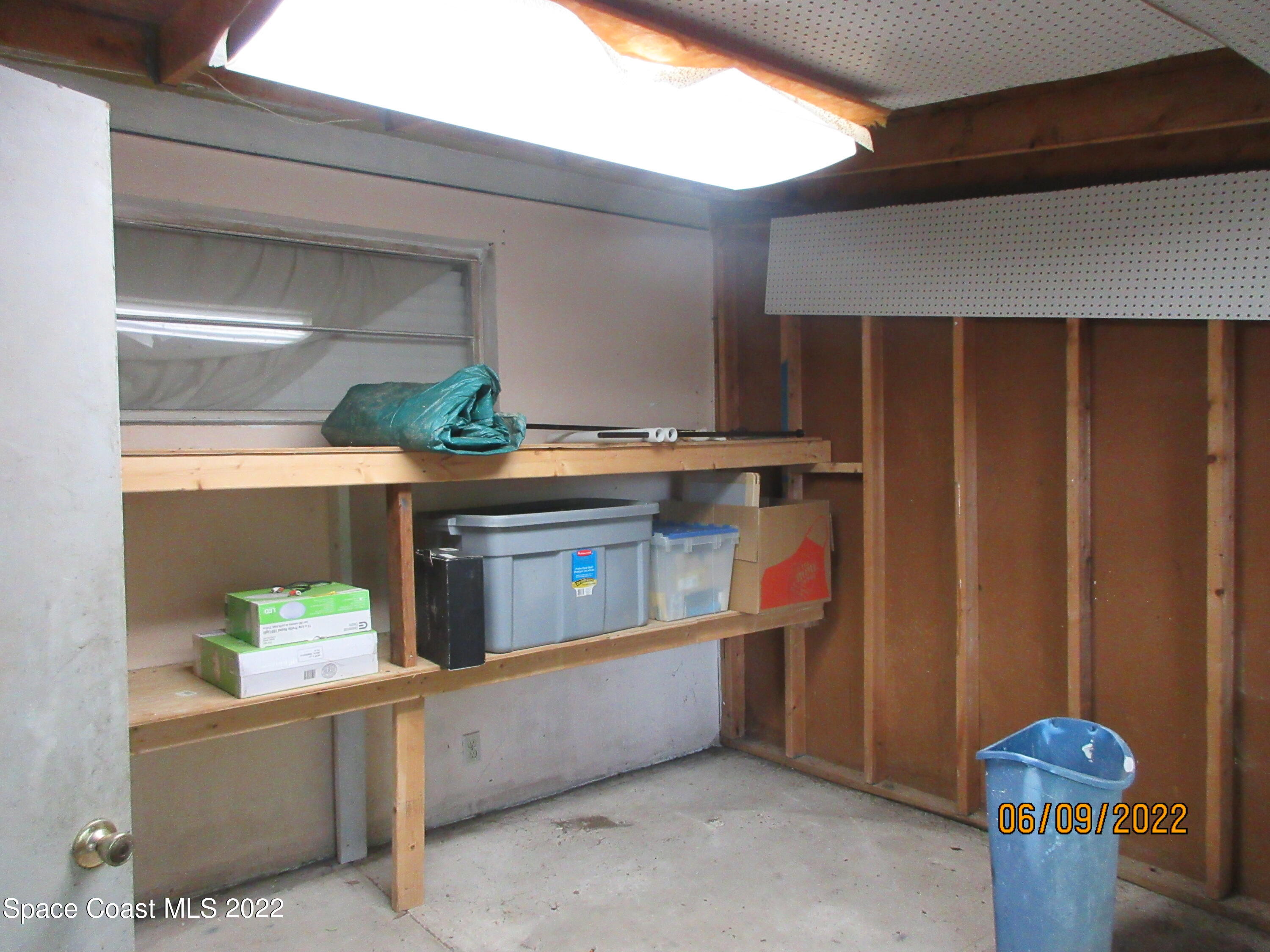 2547 Locksley Road Melbourne, FL 32935 - Photo 24 of 28 a room with storage and utility