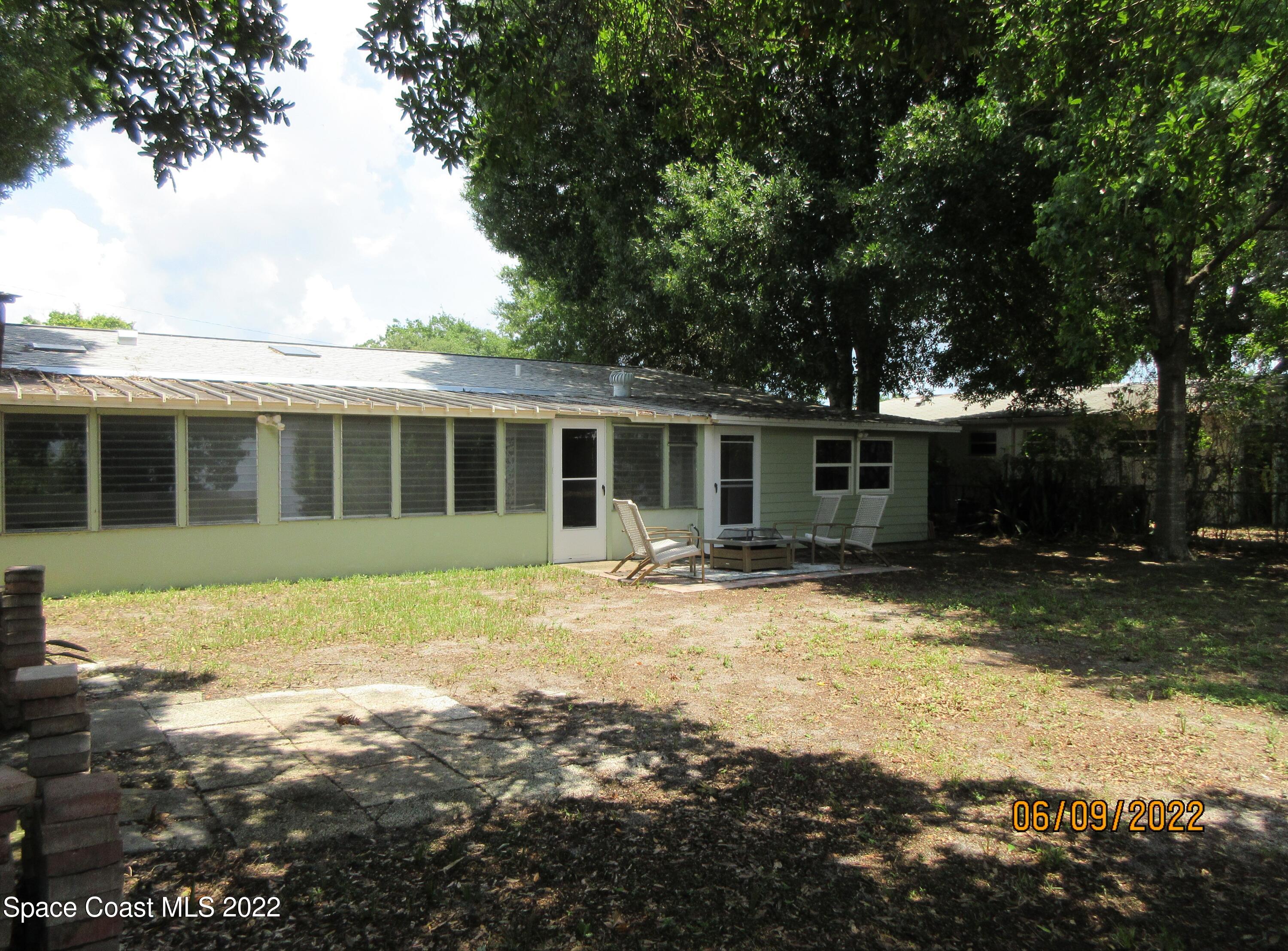 2547 Locksley Road Melbourne, FL 32935 - Photo 25 of 28 a view of a house with a yard