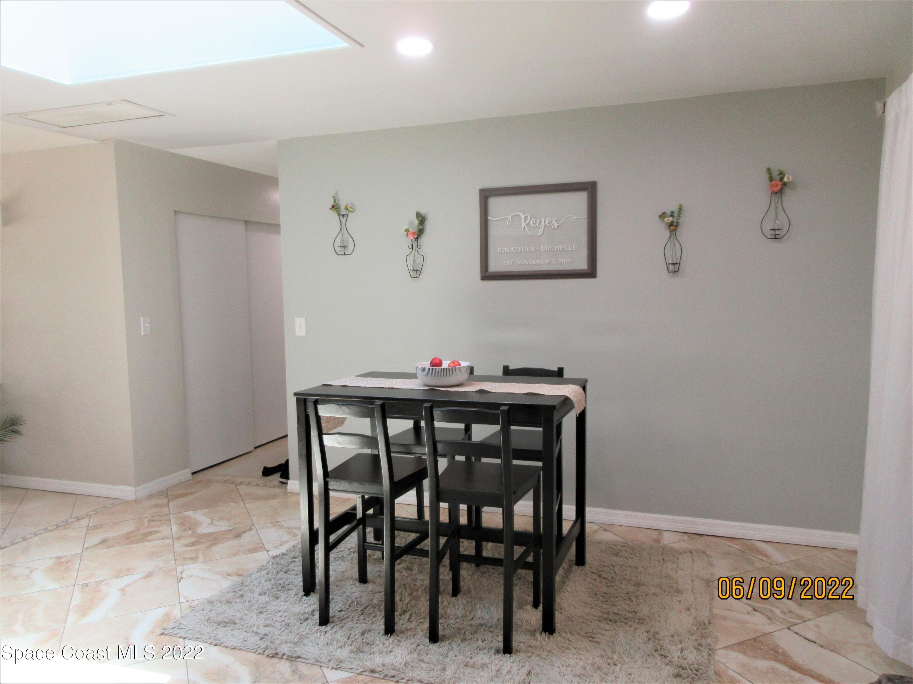 2547 Locksley Road Melbourne, FL 32935 - Photo 6 of 28 a view of a dining room with furniture