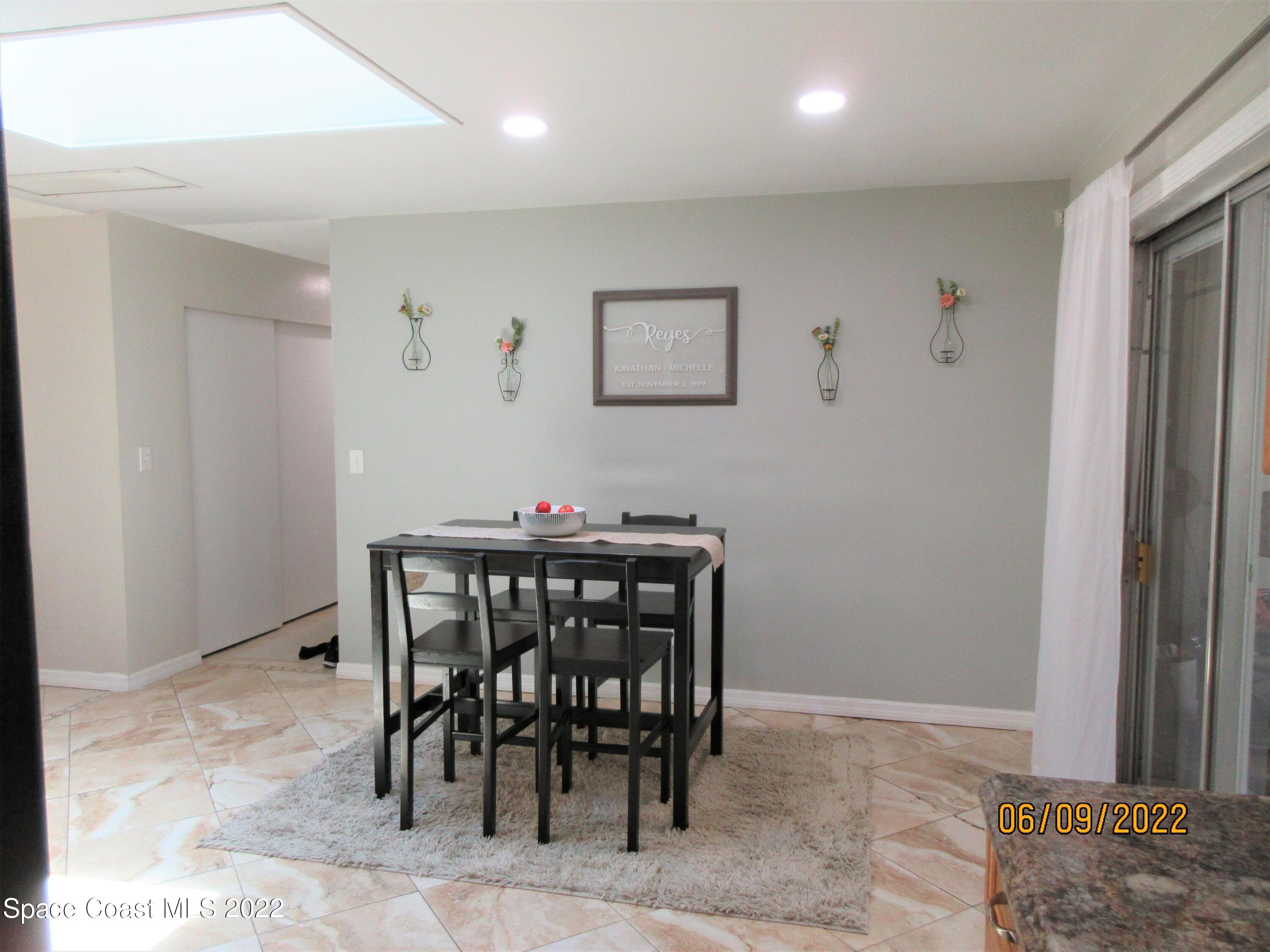 2547 Locksley Road Melbourne, FL 32935 - Photo 7 of 28 a view of a dining room with furniture