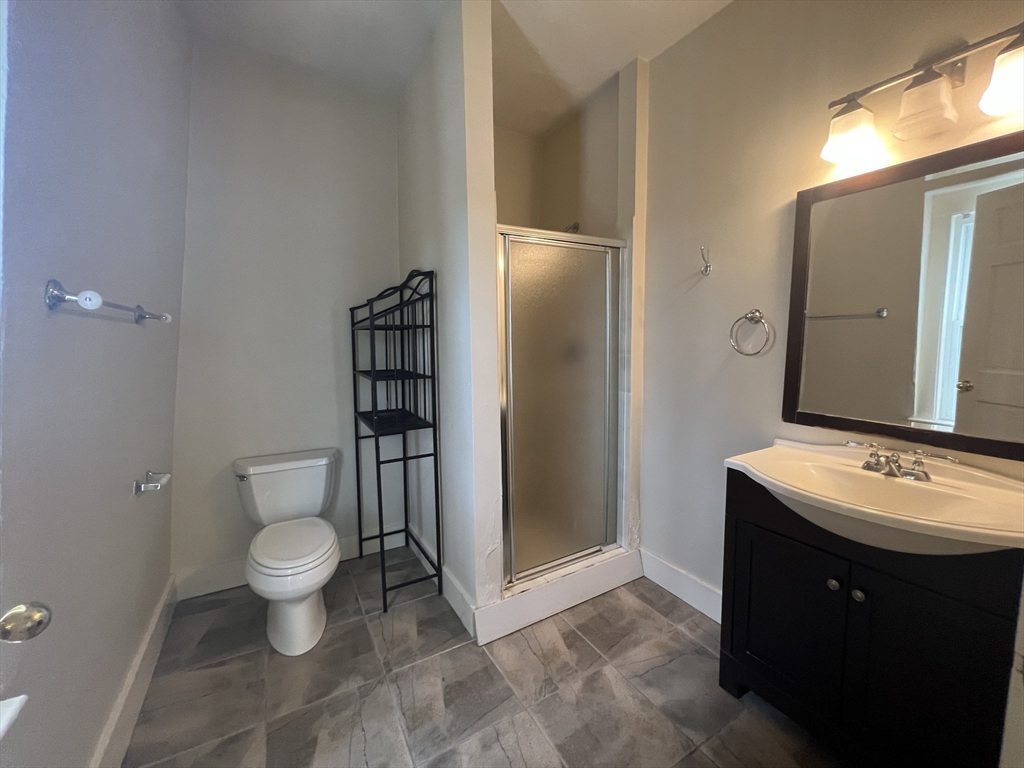 76 Chestnut Street, Unit 2 Newton, MA 02465 - Photo 18 of 21 a bathroom with a sink toilet and shower