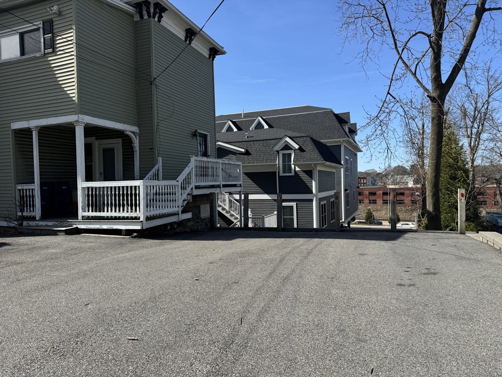 76 Chestnut Street, Unit 2 Newton, MA 02465 - Photo 20 of 21 front view of a house with a street