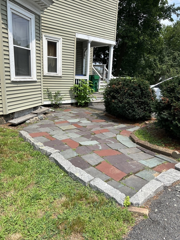 76 Chestnut Street, Unit 2 Newton, MA 02465 - Photo 21 of 21 a front view of a house with garden
