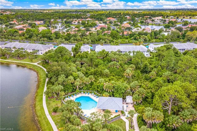 an aerial view of residential house with outdoor space and swimming pool