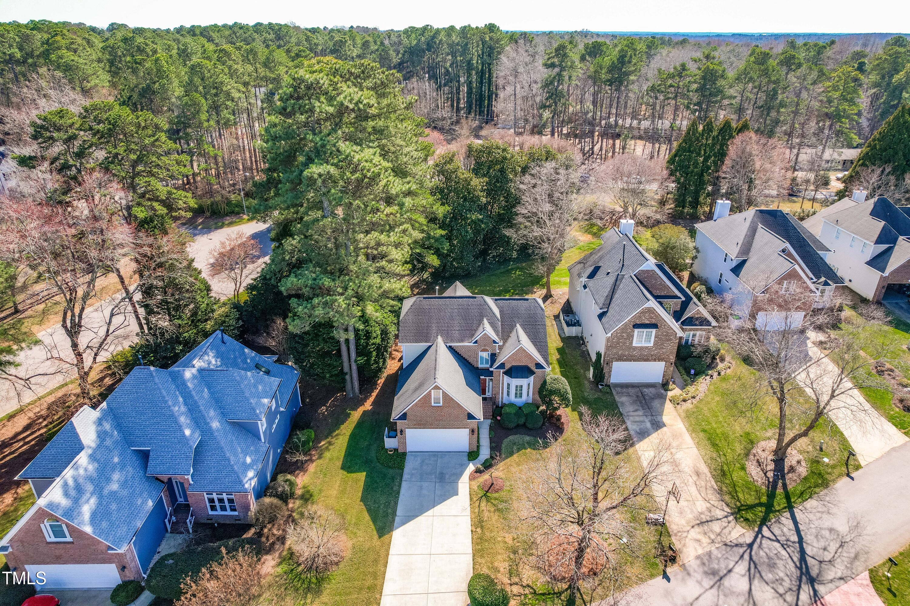 2909 Hawtree Drive Raleigh, NC 27613 - Photo 4 of 38 an aerial view of houses with yard