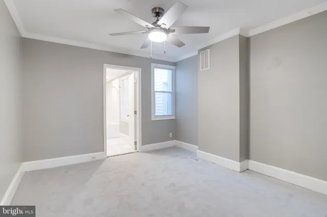 a view of an empty room with a window