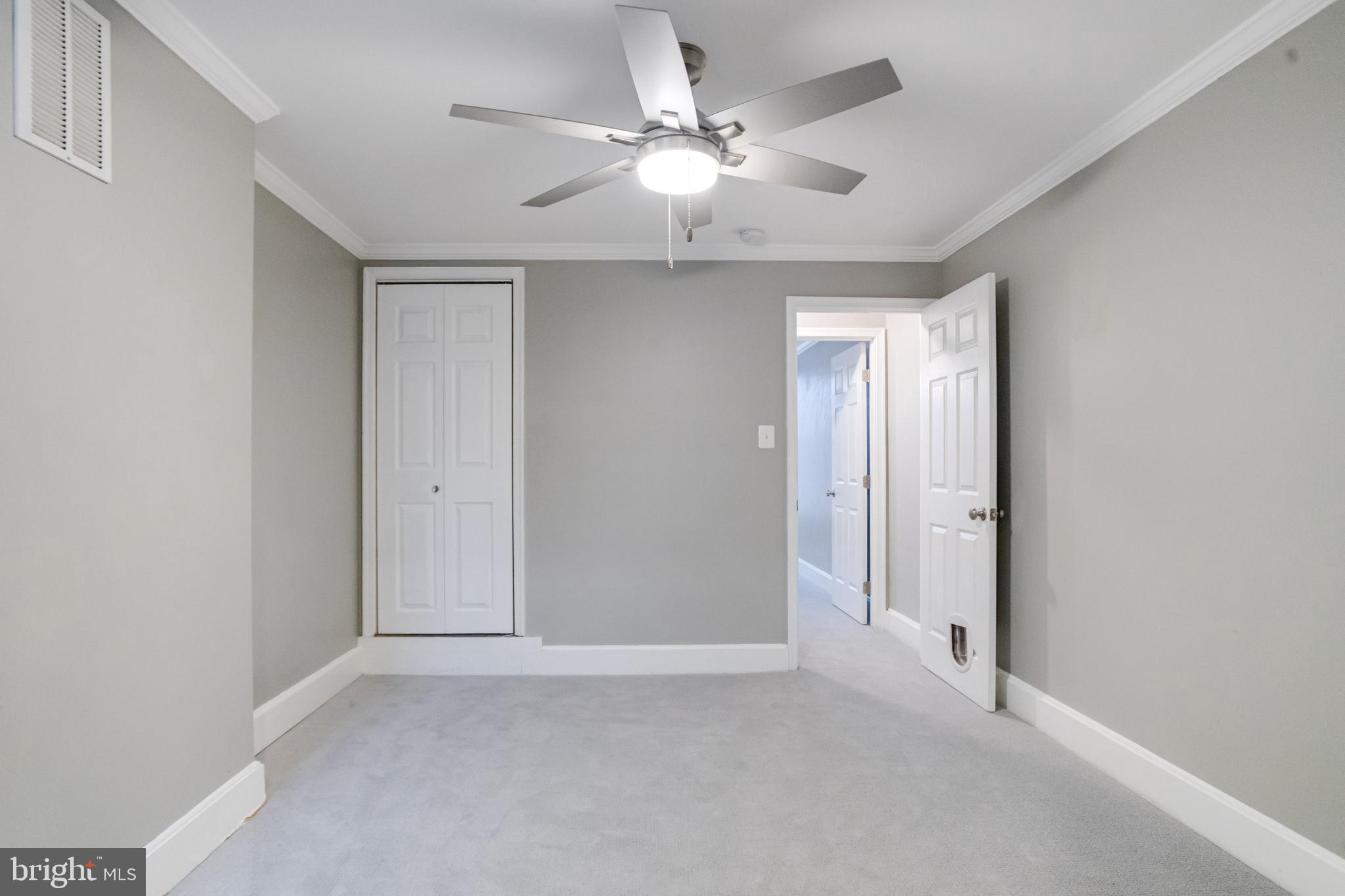 1313 Patapsco Street Baltimore, MD 21230 - Photo 21 of 52 an empty room with chandelier fan