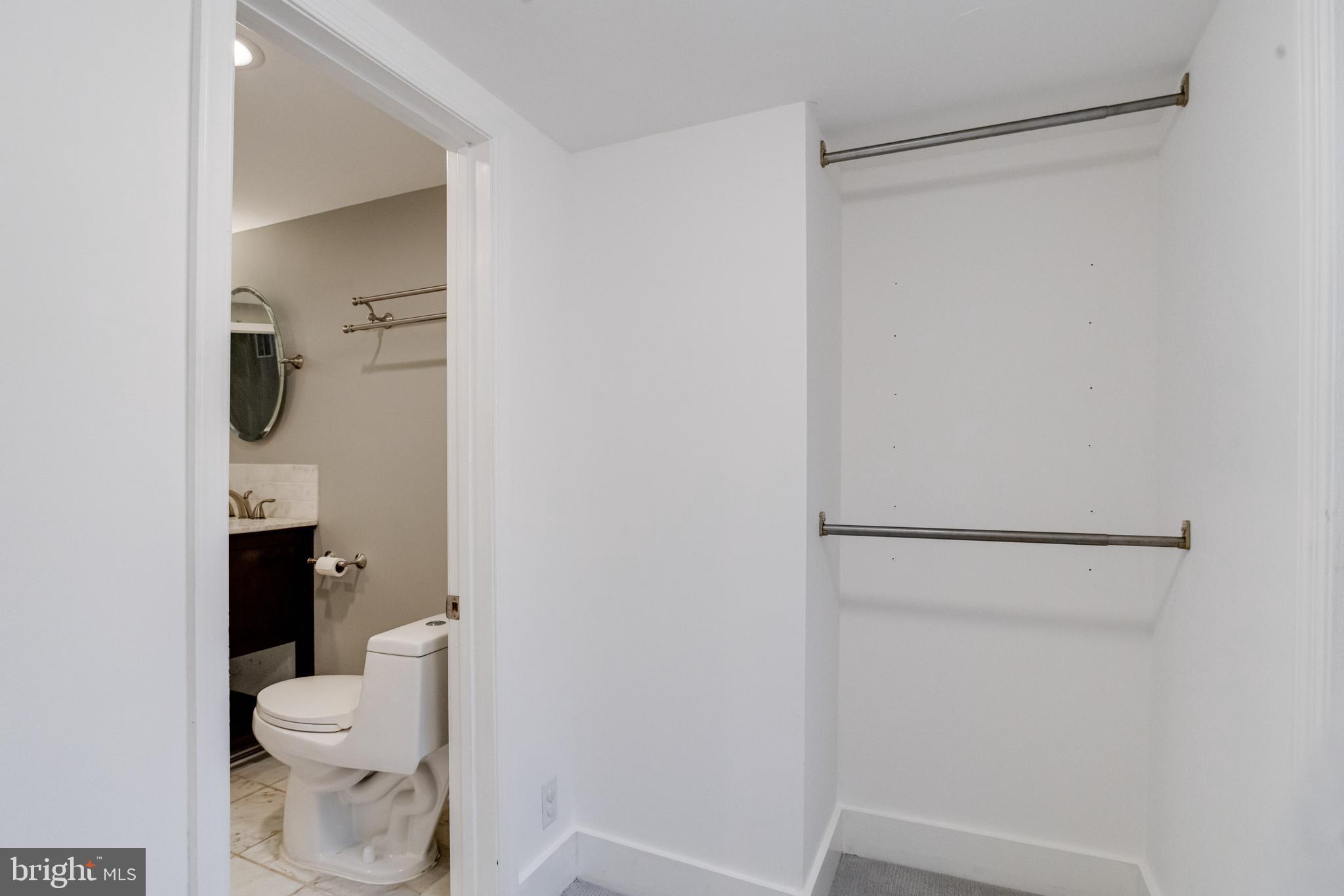 1313 Patapsco Street Baltimore, MD 21230 - Photo 30 of 52 a white toilet sitting next to a bathroom sink