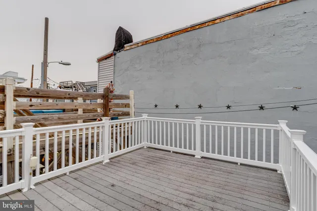 a view of a balcony with wooden floor