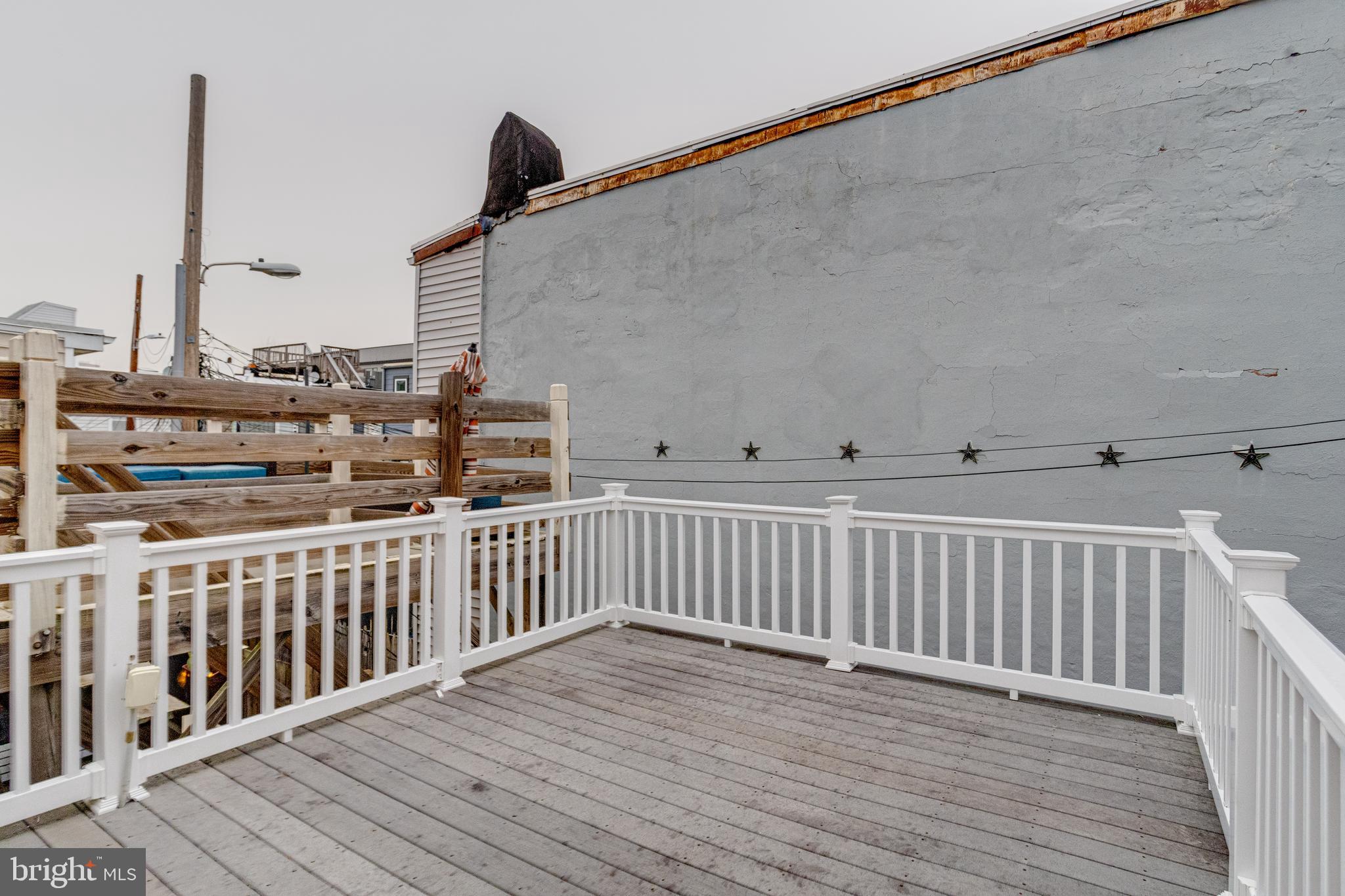 1313 Patapsco Street Baltimore, MD 21230 - Photo 32 of 52 a view of a balcony with wooden floor