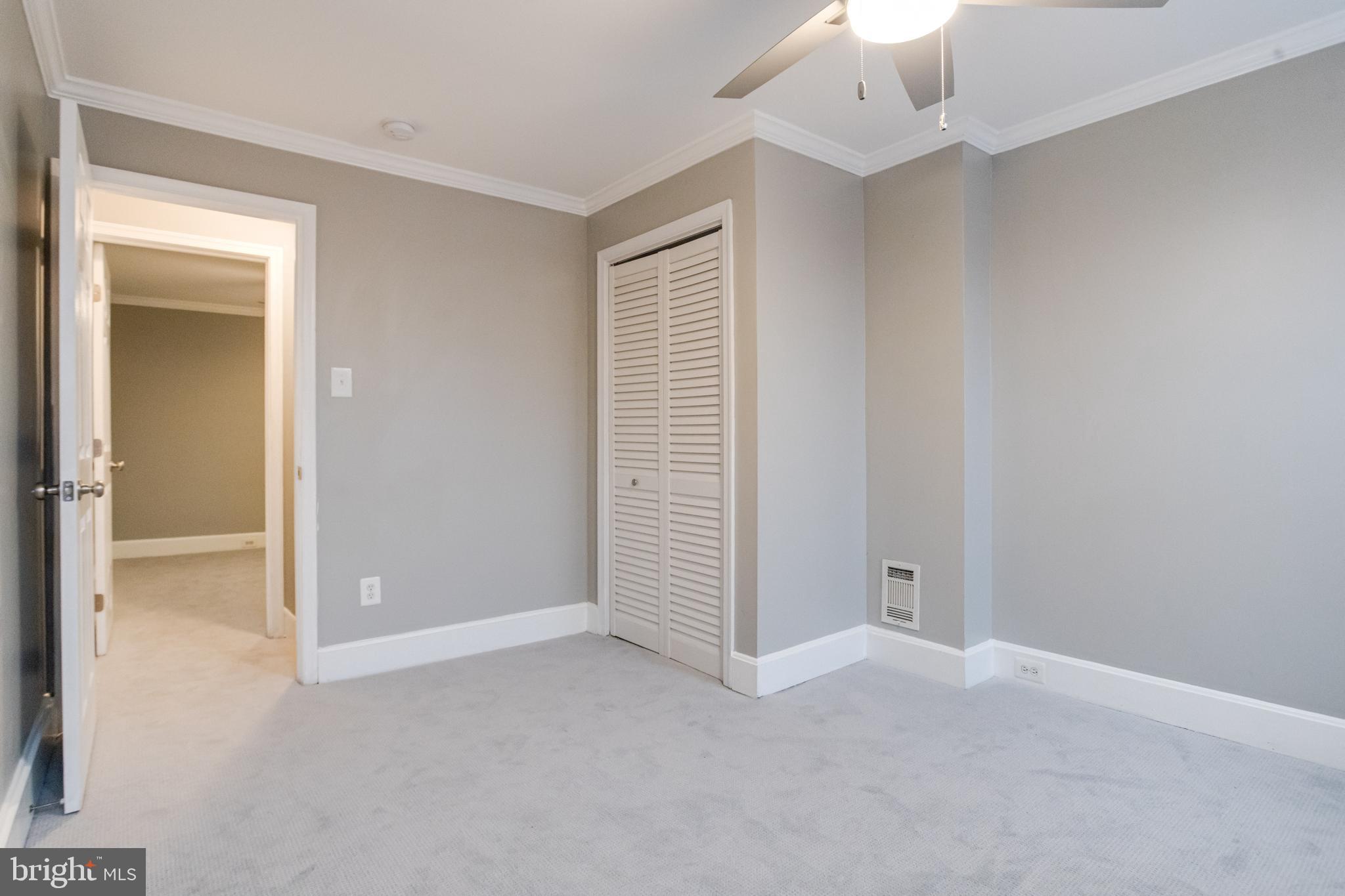 1313 Patapsco Street Baltimore, MD 21230 - Photo 38 of 52 an empty room with windows and closet