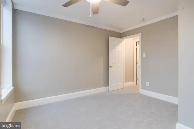 a view of entryway with wooden floor and stairs