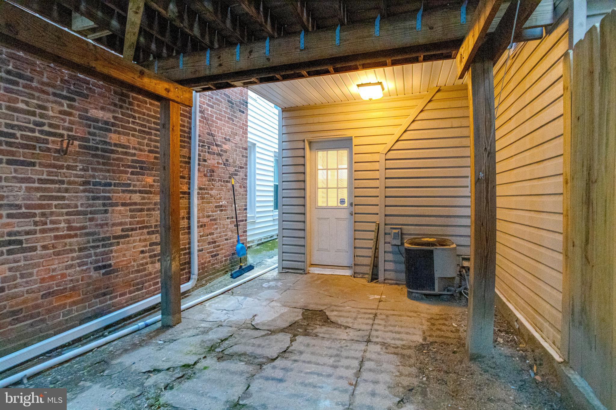 1313 Patapsco Street Baltimore, MD 21230 - Photo 50 of 52 a view of a porch with a door and wooden floor