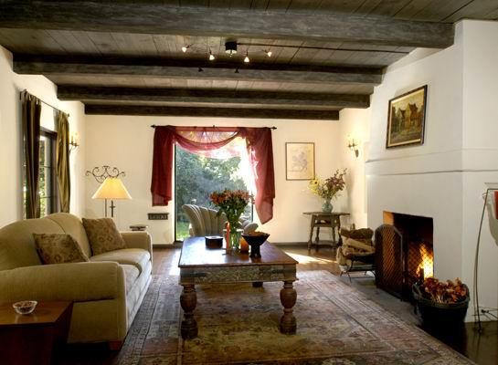 490 Hot Springs Road Santa Barbara, CA 93108 - Photo 2 of 6 a living room with furniture and a fireplace