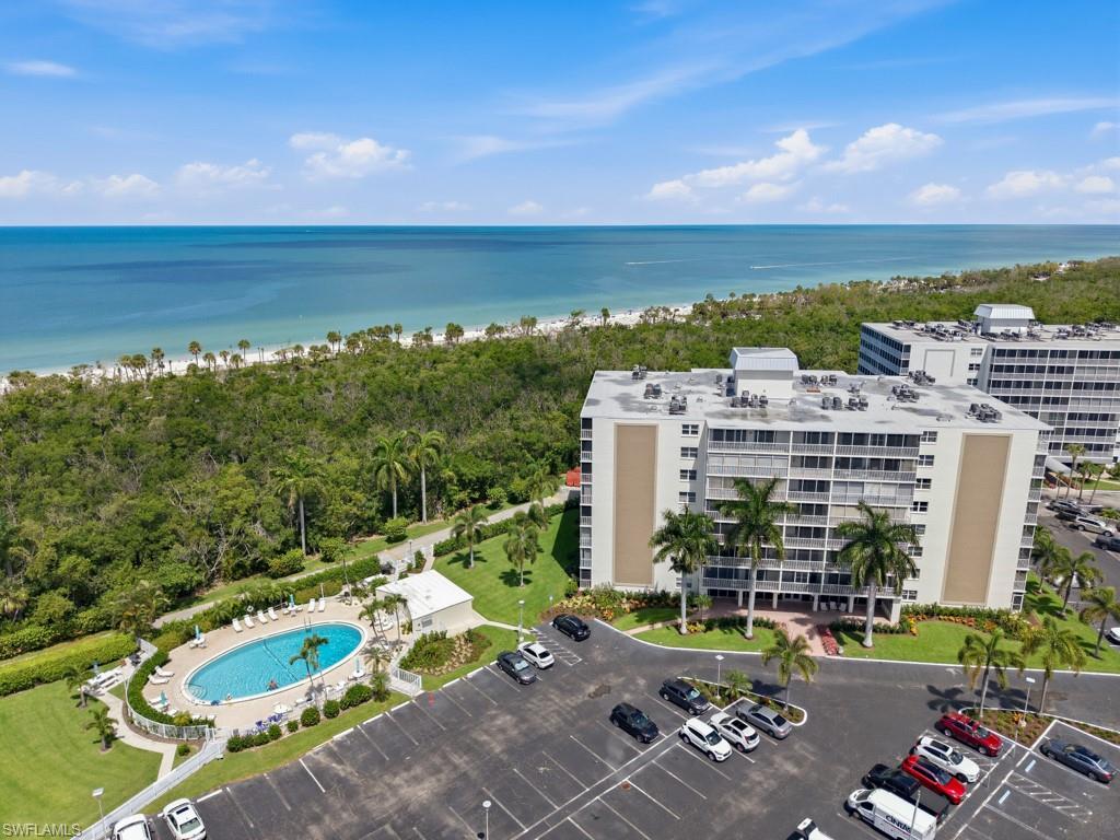 3 Bluebill Avenue, Unit 206 Naples, FL 34108 - Photo 2 of 19 an aerial view of a city with lawn chairs