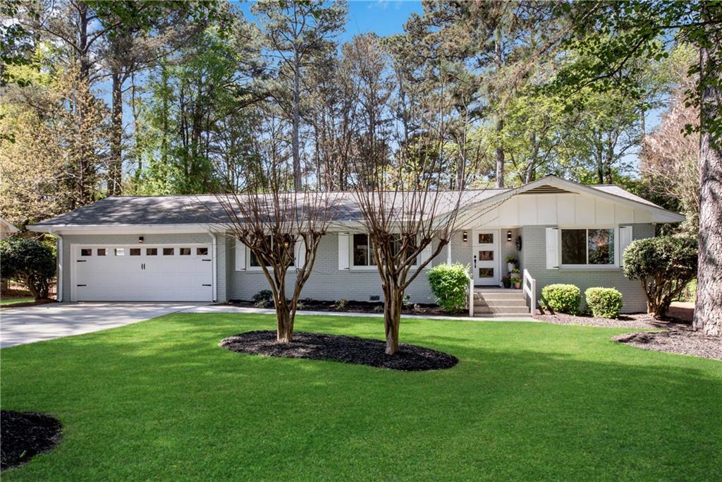 Wonderfully updated four-side painted brick ranch with open floorplan in Dunwoody
