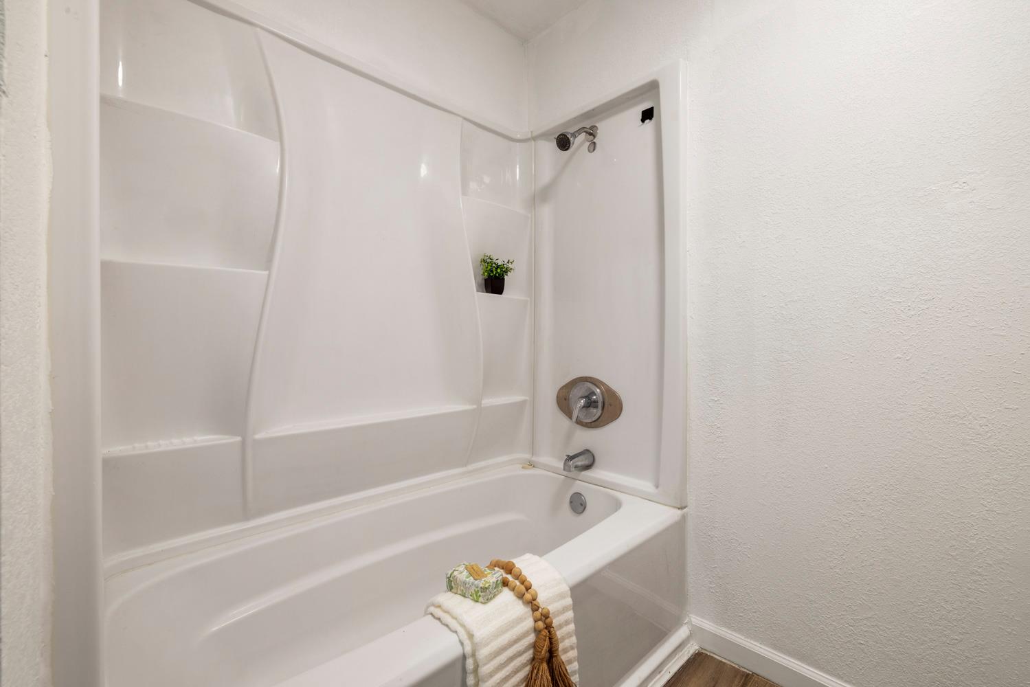 2621 Prescott Road, Unit 79 Modesto, CA 95350 - Photo 38 of 41 a bathroom with a bathtub and shower