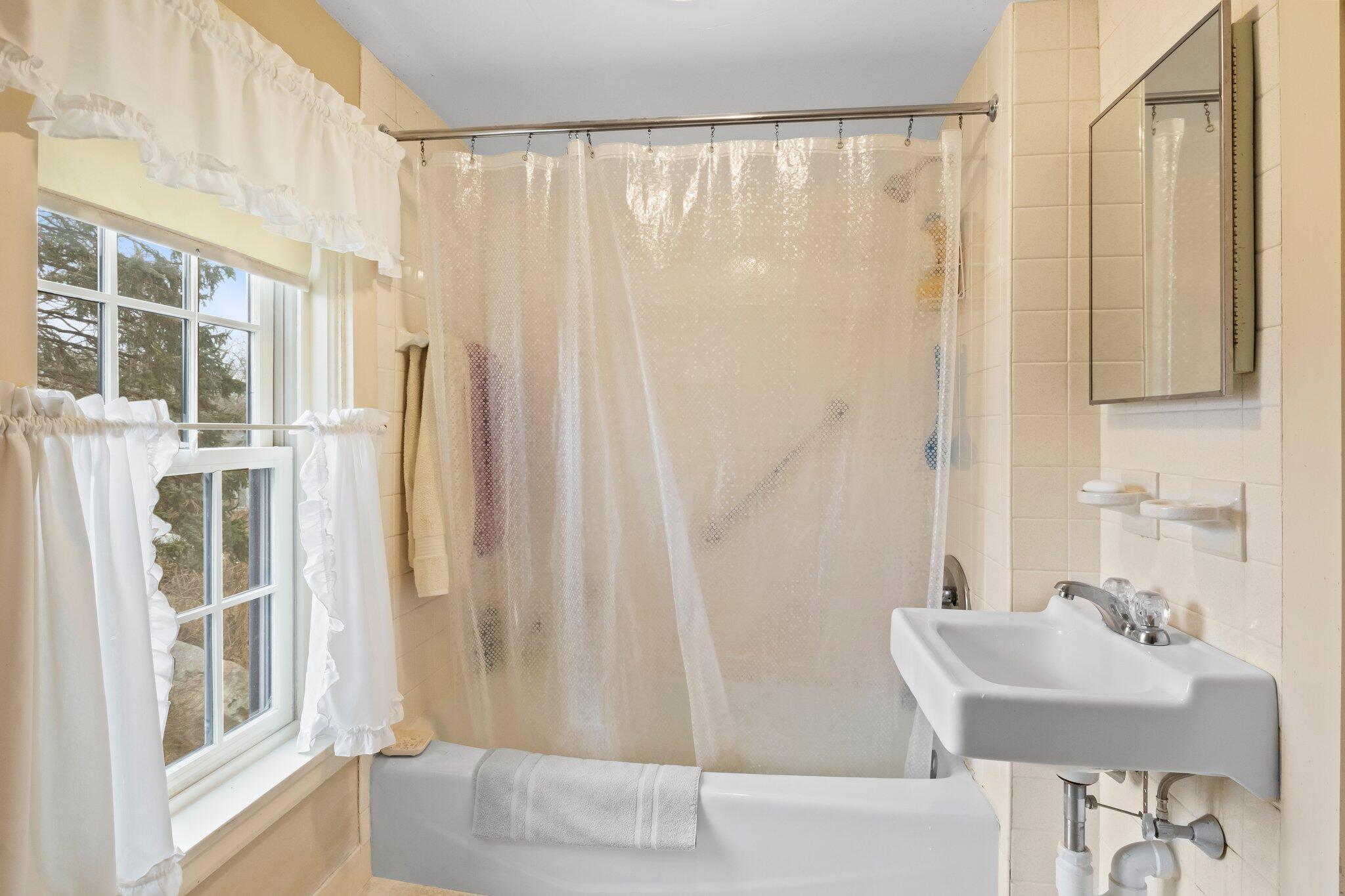 12 Childs Homestead Road Orleans, MA 02653 - Photo 20 of 39 a bathroom with a sink and a mirror