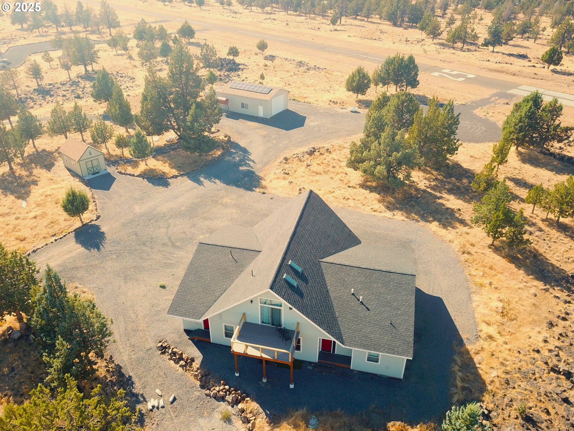 13422 Southwest Airfield Lane Culver, OR 97734 - Photo 1 of 42 an aerial view of residential houses with outdoor space