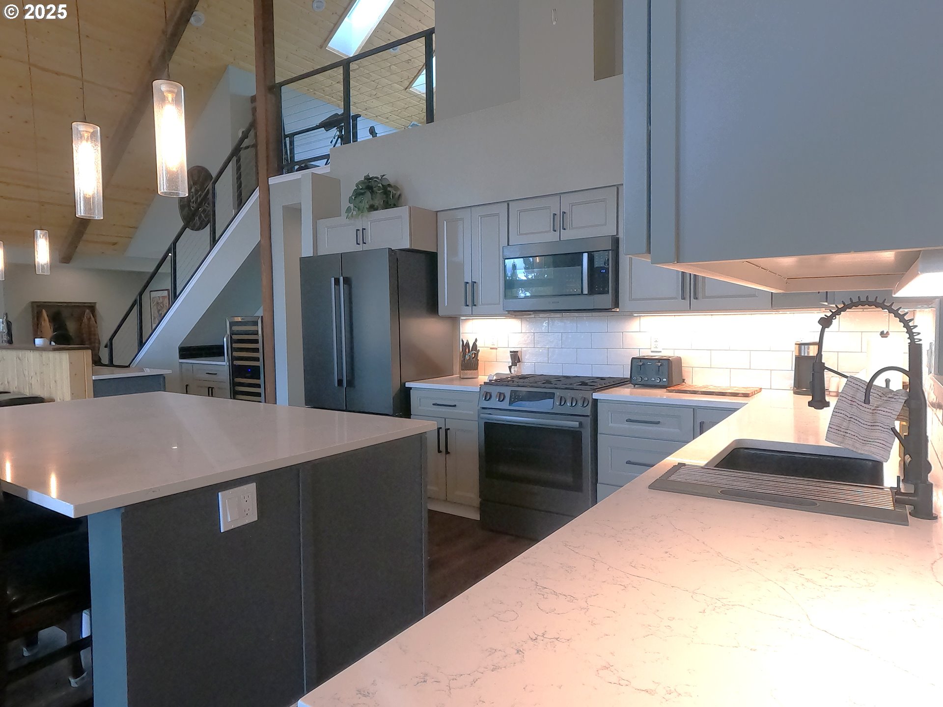 13422 Southwest Airfield Lane Culver, OR 97734 - Photo 13 of 42 a kitchen with stainless steel appliances kitchen island a stove and a sink