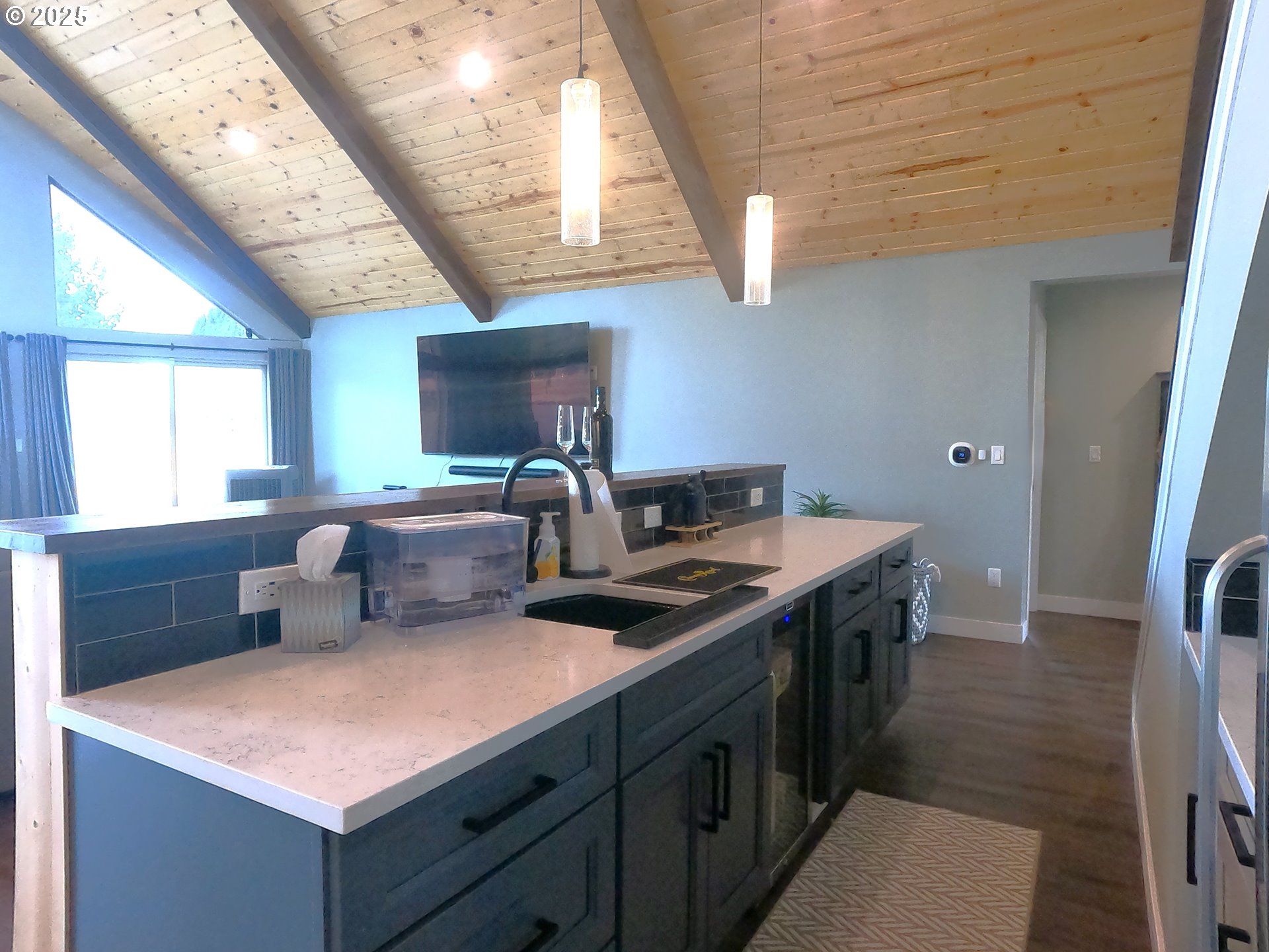 13422 Southwest Airfield Lane Culver, OR 97734 - Photo 14 of 42 a kitchen with stainless steel appliances a sink a stove a refrigerator cabinets and a dining table