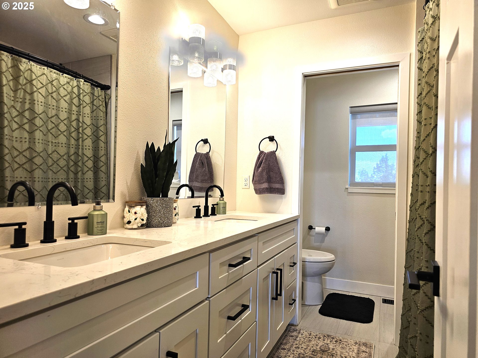13422 Southwest Airfield Lane Culver, OR 97734 - Photo 29 of 42 a bathroom with a double vanity sink toilet and shower