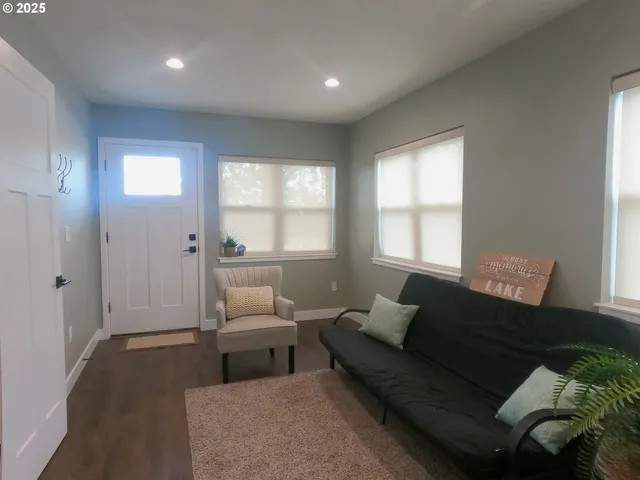 a view of a yard with large trees