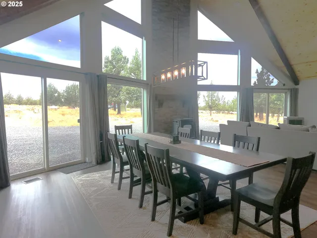 a view of a dining room with furniture and window