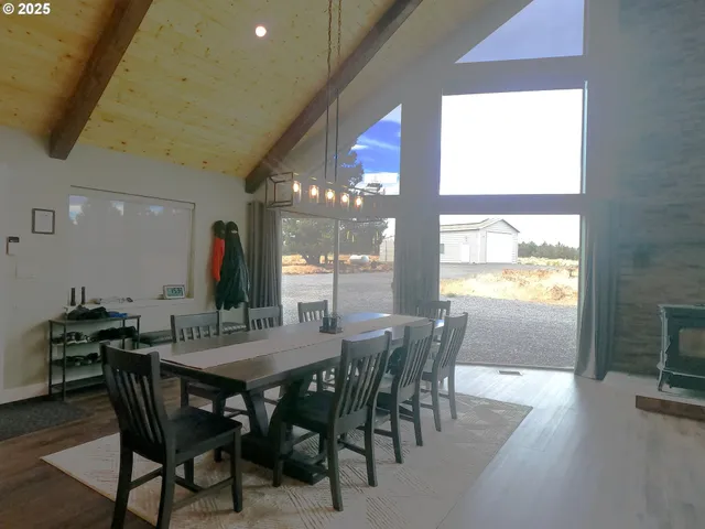 a view of a dining room with furniture window and outside view