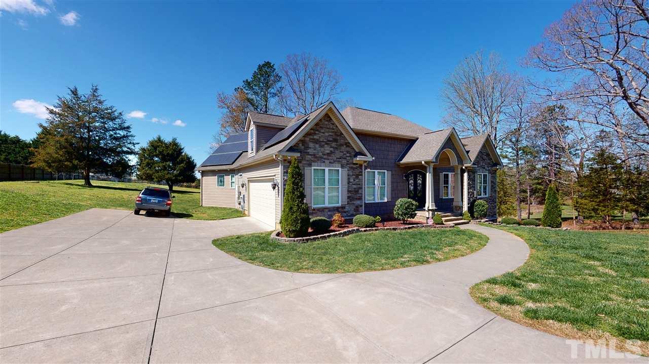 3537 Saddle Ridge Road Stem, NC 27581 - Photo 2 of 29 a front view of a house with a yard